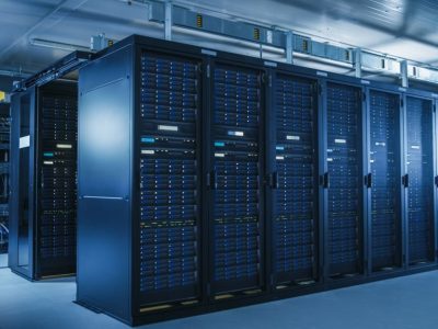 Data Centers Shot of Modern Data Center With Multiple Rows of Operational Server Racks. Modern High-Tech Database Super Computer Clean Room.