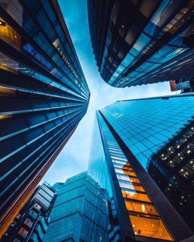 Looking directly up at the skyline of the financial district in central London