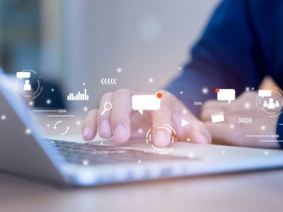 close up on man hand holding smartphone with futuristic of social media marketing icon for internet network technology and business concept